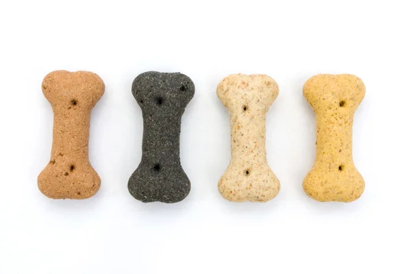 Line of bone shaped dog biscuits over white Stock Photo by