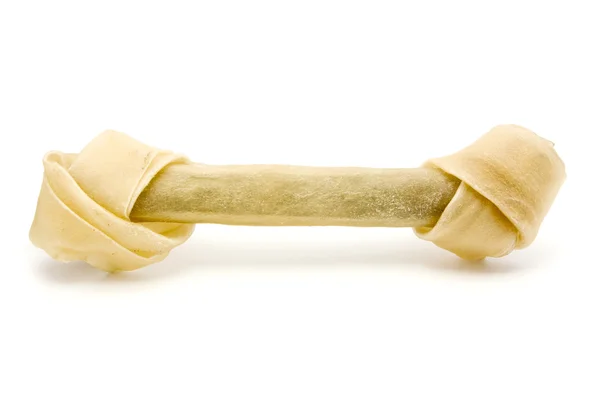 Сырая собачья кость поверх белой . — стоковое фото