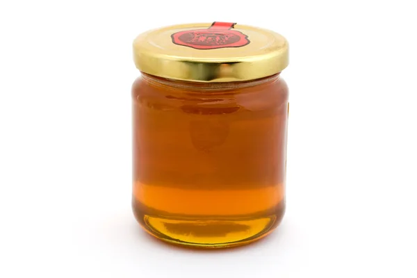 Jarro de mel sobre branco — Fotografia de Stock