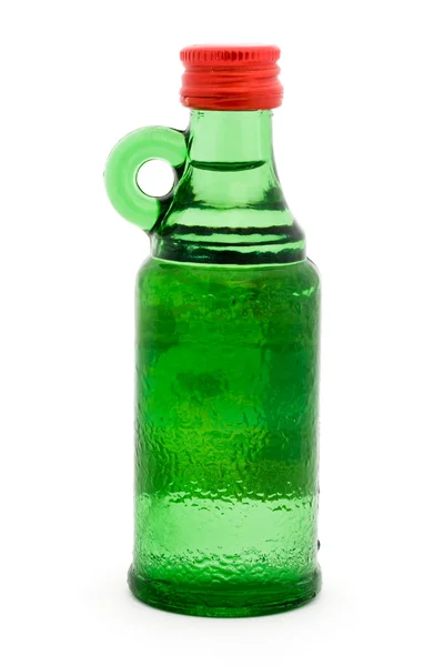 Gröna flaskan med handtag över vita — Stockfoto