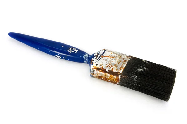 Dirty used blue paintbrush over white — Stock Photo, Image
