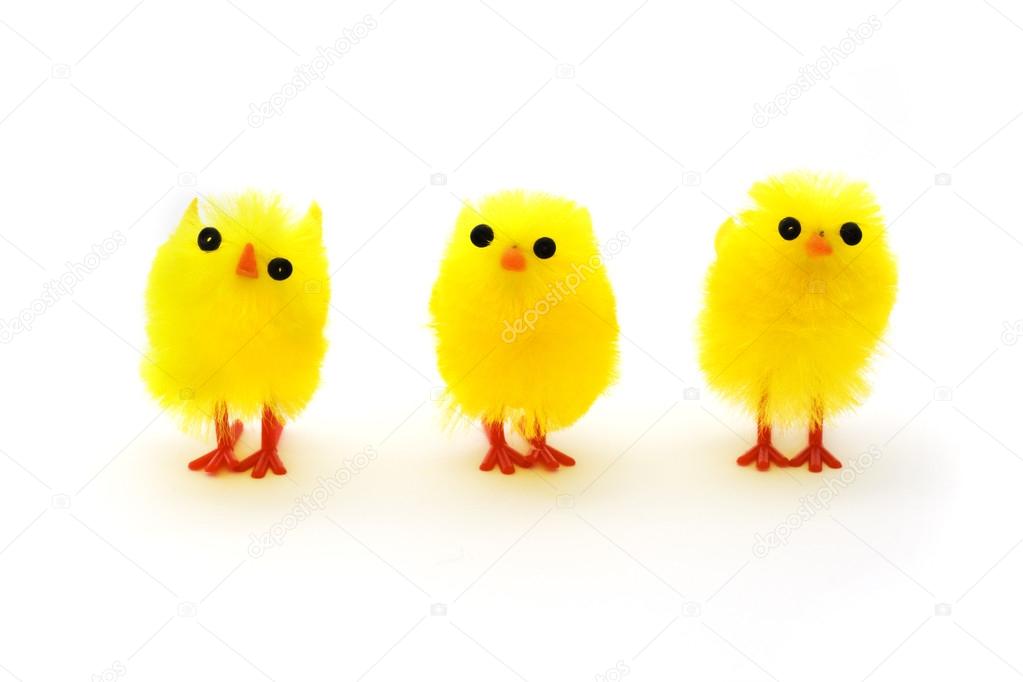 Three yellow easter chicks in a row