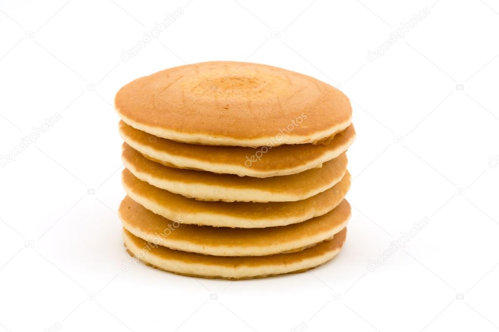 Stack of fluffy pancakes over white