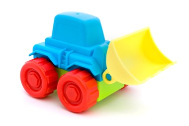 Üzerinde beyaz renkli plastik oyuncak traktör.