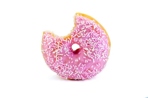 Roze donut met een hap genomen uit geïsoleerde op wit — Stockfoto