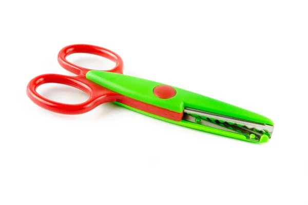 Red and green plastic scissors — Stock Photo, Image