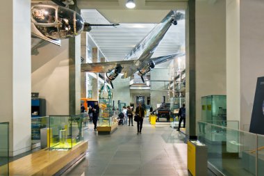 People walking through the London Science Museum clipart