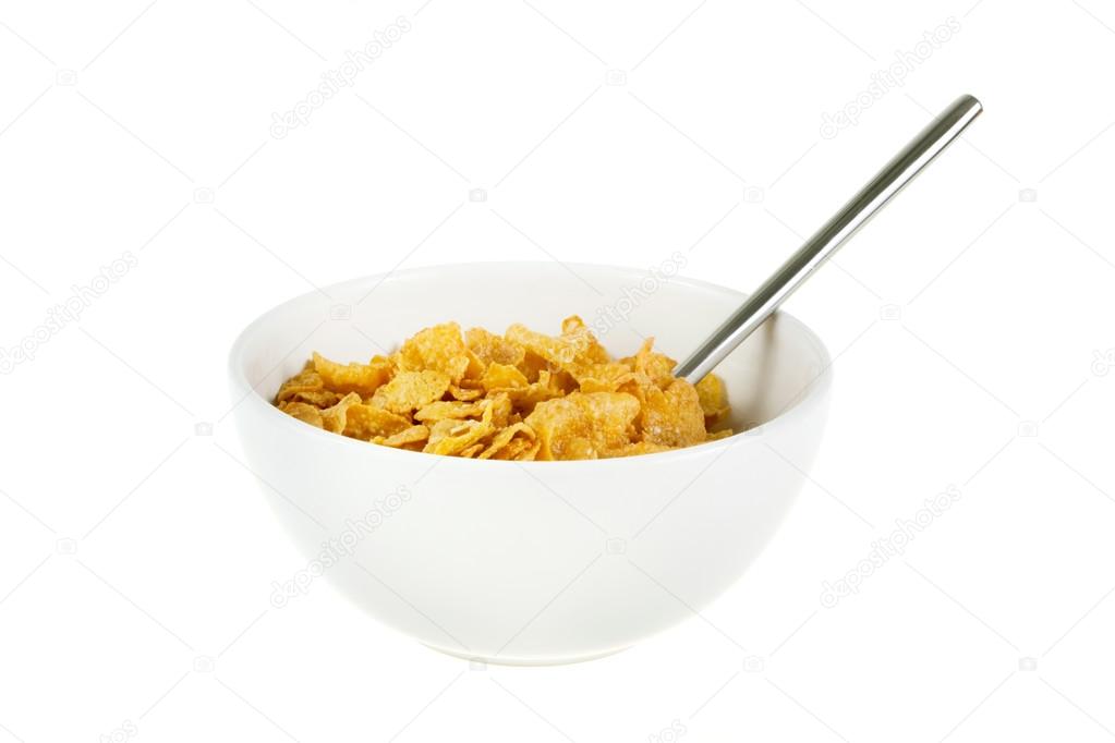 Bowl of cereal with spoon on white