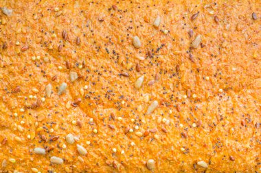 Background texture of a seeded loaf of bread clipart