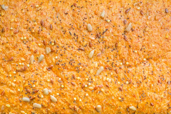 Background texture of a seeded loaf of bread — Stock Photo, Image