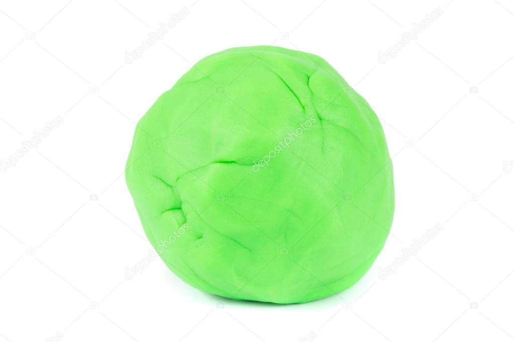 Ball of green play dough on white