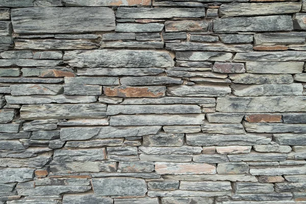 Achtergrond textuur van een leisteen stenen muur. — Stockfoto