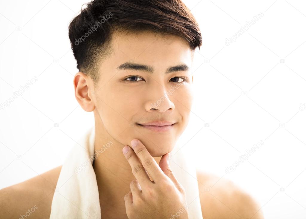 Closeup portrait of attractive young man face