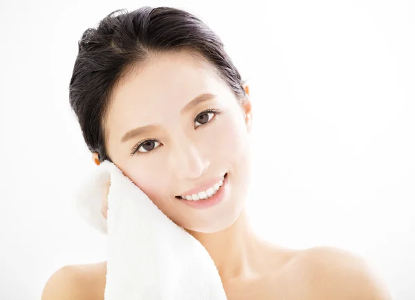 Young woman cleaning her face with  towel — Stock Photo, Image