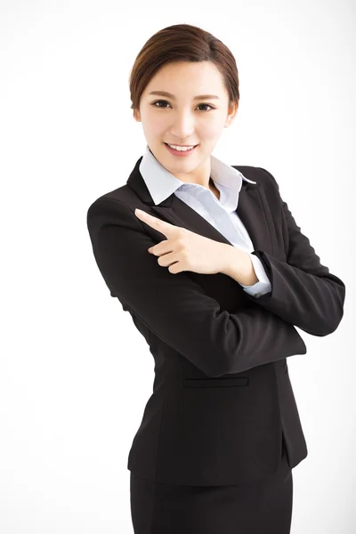 Gyönyörű fiatal üzleti nő mutatva-hoz valahol — Stock Fotó