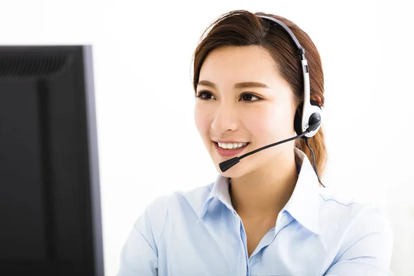 Smiling agent business woman with headsets — Stock Photo, Image