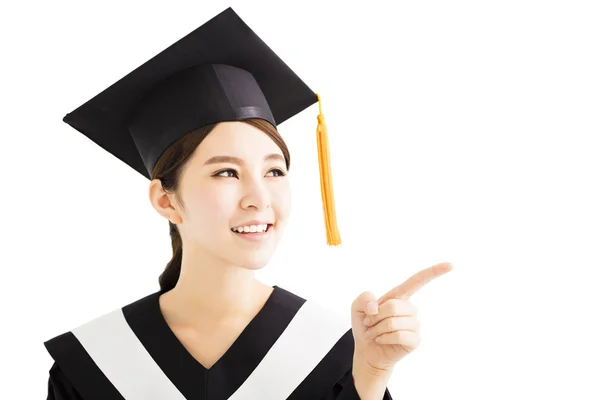 Young female  graduation student pointing and looking — Stock Photo, Image