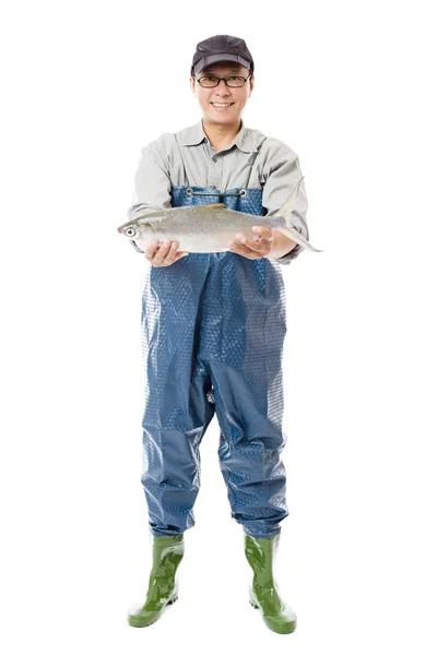 Happy fisherman showing big fish isolated on white — Stock Photo, Image