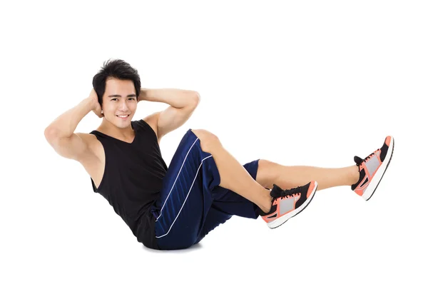 Giovane uomo fitness fare esercizi di stretching — Foto Stock