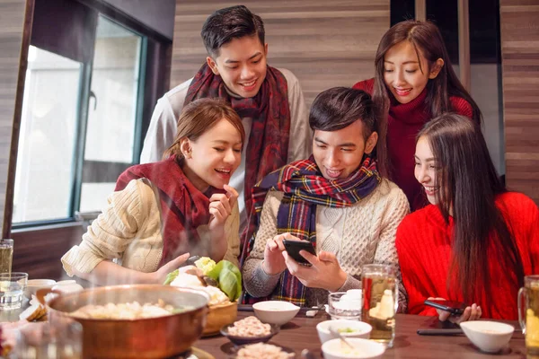 Happy Young Group Watching Smart Phone Restaurant — Stock Photo, Image