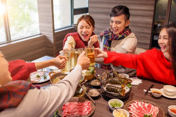 Happy Young Group Toasting Beer Hot Pot Restaurant — Stock Photo, Image