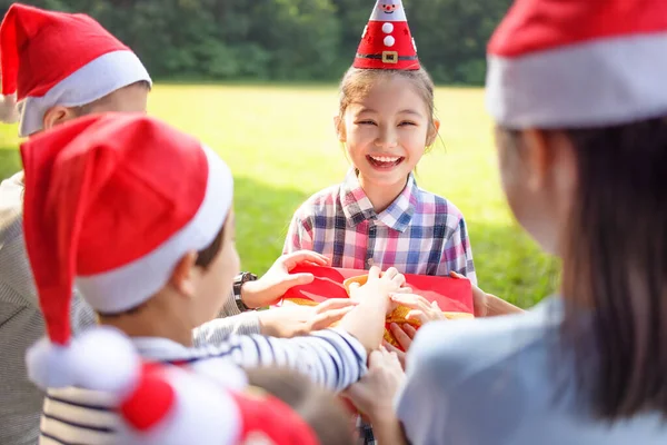 Happy Children Santa Red Hat Holding Christmas Gifts — Stock fotografie