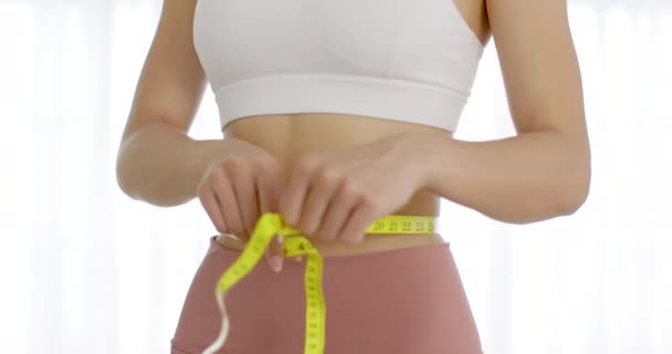 Slim Young Woman Measuring Her Waist Measurement Tape — Stock videók