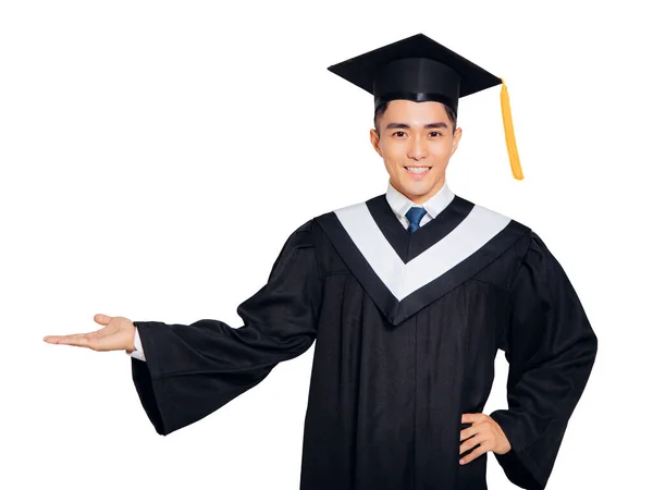 Smiling Male Graduation Student Showing Something Empty Hand — Stock Photo, Image