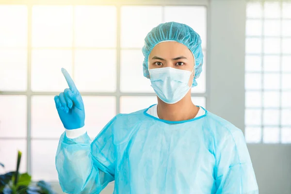 Asian Male Doctor Medical Mask Pointing Upper Left Corner — Stock Photo, Image