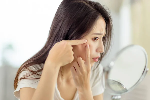 Woman Looking Mirror Checking Acne Problem Home — Zdjęcie stockowe