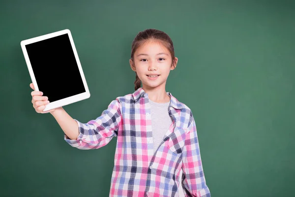 Happy Student Girl Showing Tablet Isolated Green Chalkboard Background — Stock Photo, Image