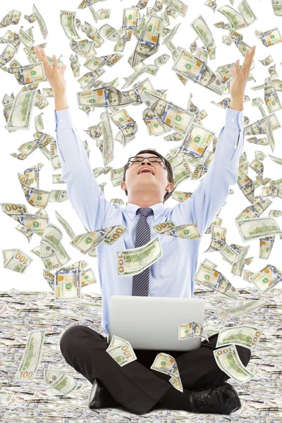 Happy business man raise hands to grab money — Stock Photo, Image