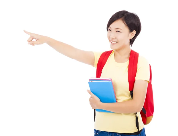 Felice studente ragazza tenendo libro e puntando — Foto Stock