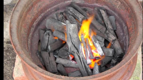 Burning charcoal in metal rim — Stock Video