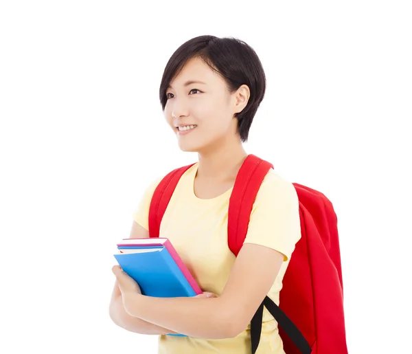 Joven estudiante chica de pie y sosteniendo libro — Foto de Stock