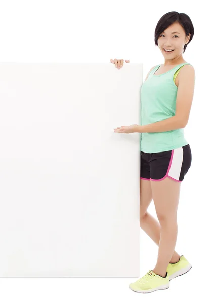 Young female athletes holding a empty board — Stock Photo, Image