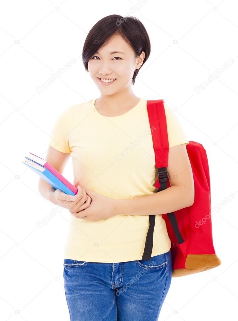beautiful university student girl standing and holding book