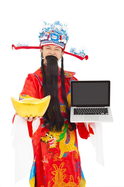 Gott des Reichtums hält Laptop und Goldbarren in der Hand — Stockfoto