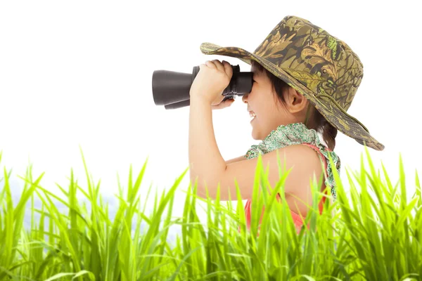 Happy little girl looking through binoculars outdoors. — Stock Photo, Image