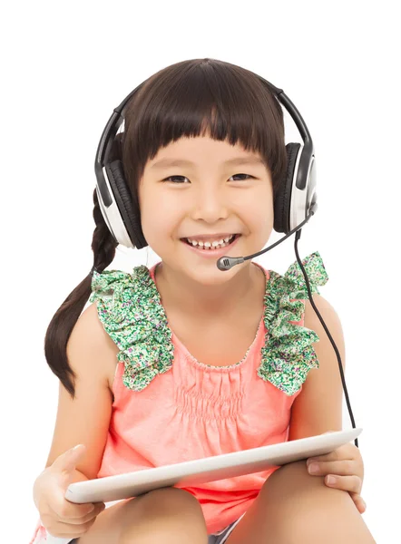 Closeup of little student girl holding a tablet — Stock Photo, Image