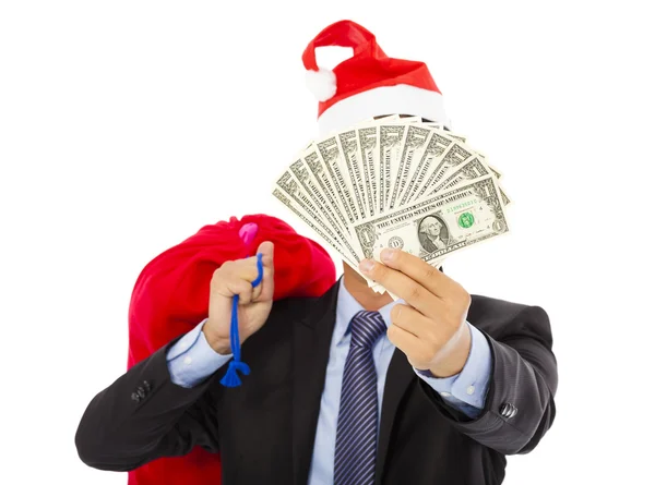 Business man holding a christmas gift bag and money — Stock Photo, Image