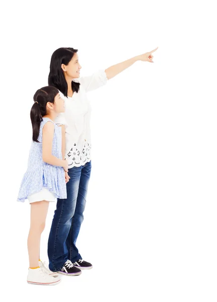 Happy mother and daughter  looking and pointing — Stock Photo, Image