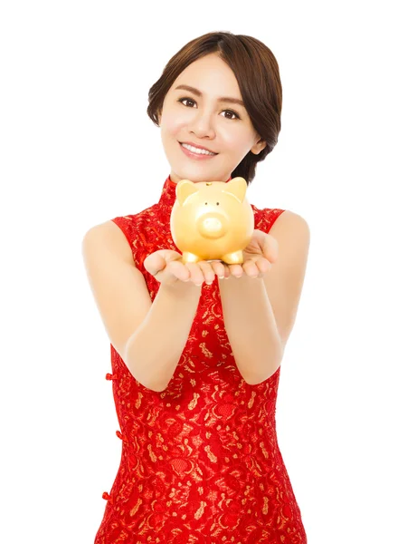 Asian woman holding a golden piggy bank . happy chinese new year — Stock Photo, Image