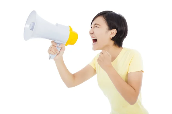 Glückliche junge Studentin steht und hält Megafon über whi — Stockfoto