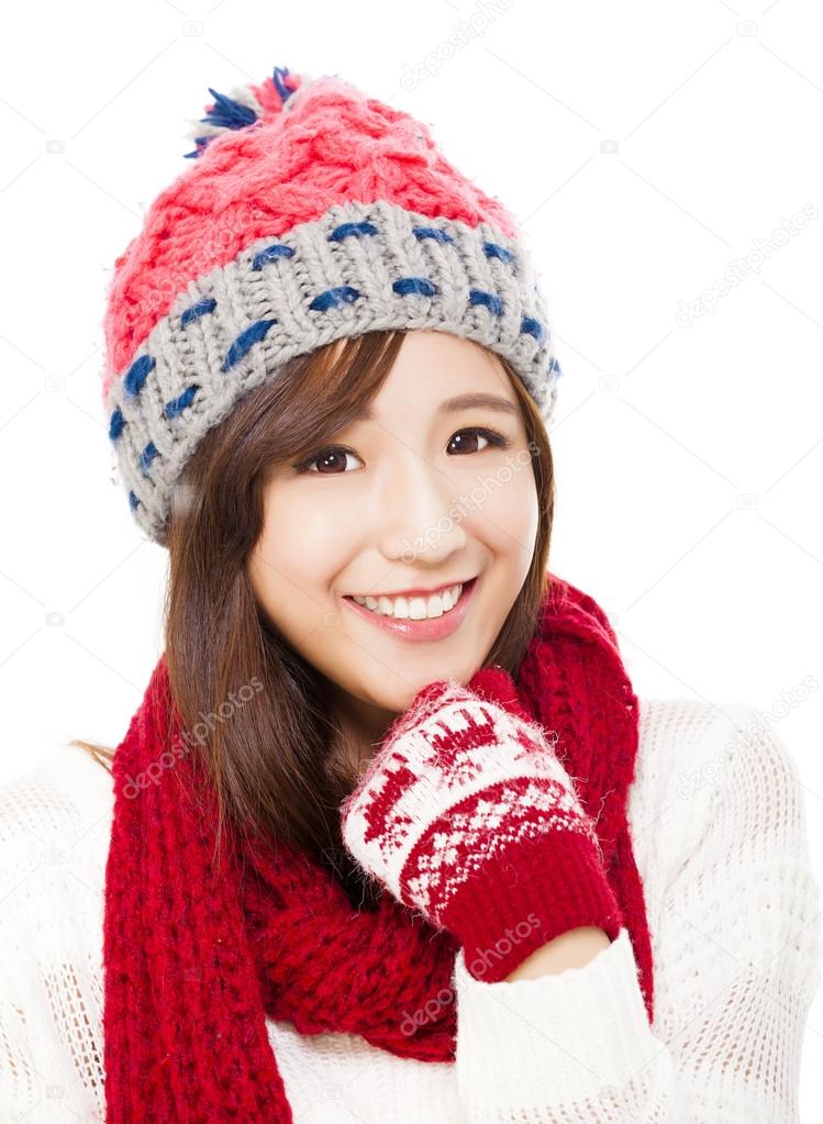 close up of beautiful asian woman in hat, muffler and mittens. h