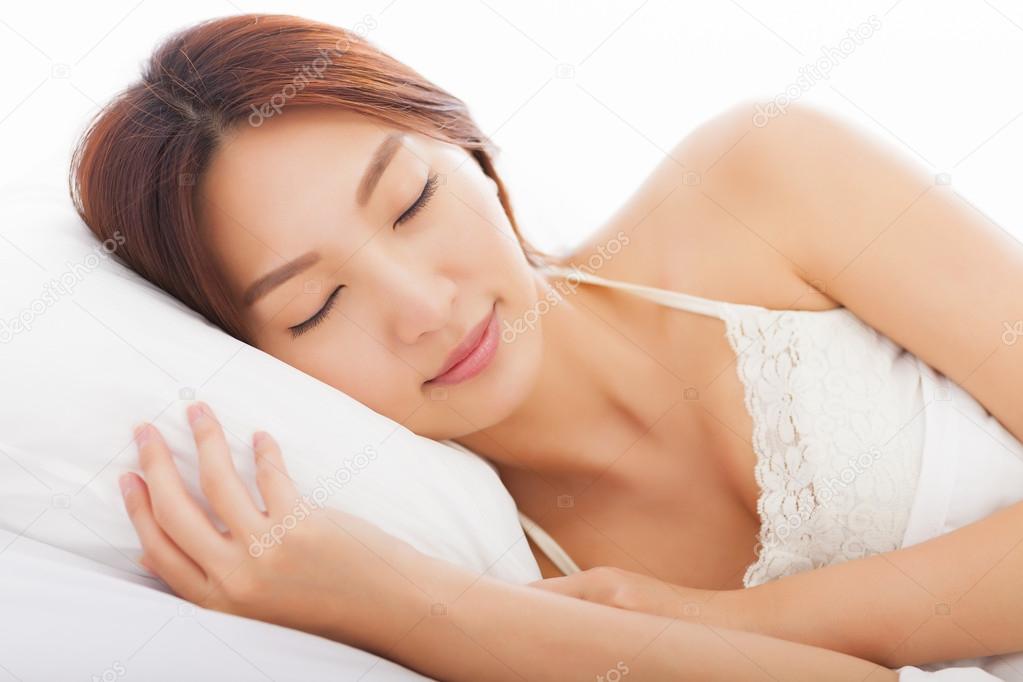 beautiful young  woman sleeping in the bed