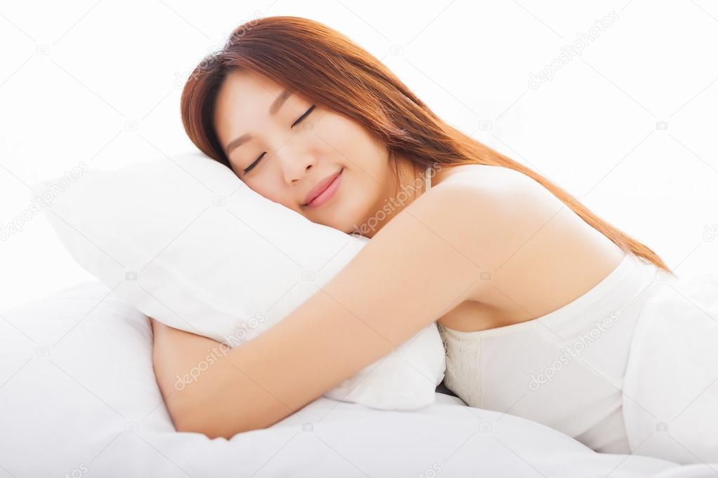 beautiful young  woman sleeping in the bed