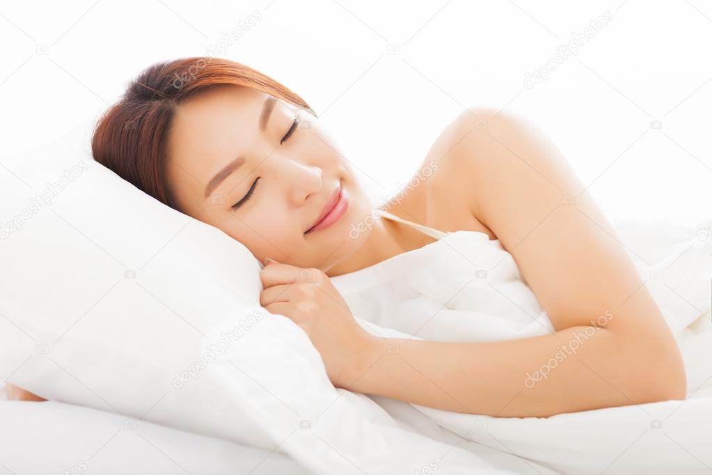 beautiful young  asian woman sleeping in the bed