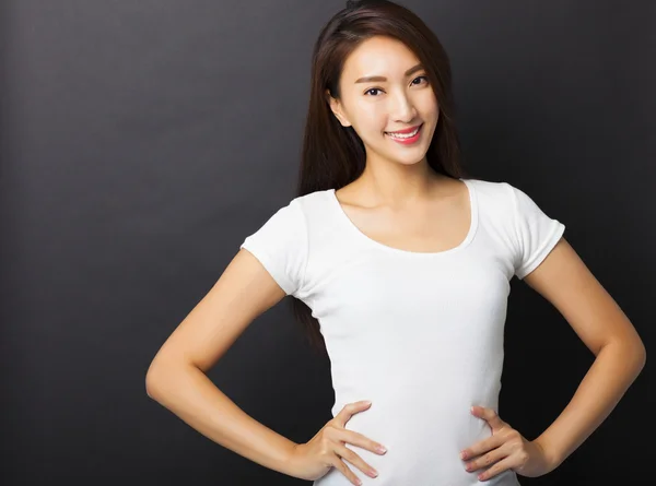 Beautiful young woman with black ground — Stock Photo, Image