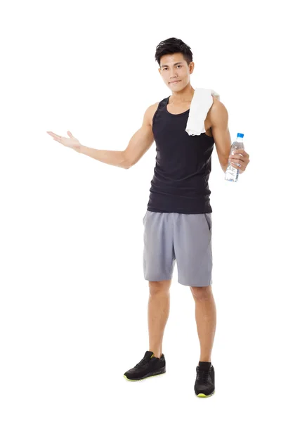 Full length  of smiling  young  man  showing — Stock Photo, Image